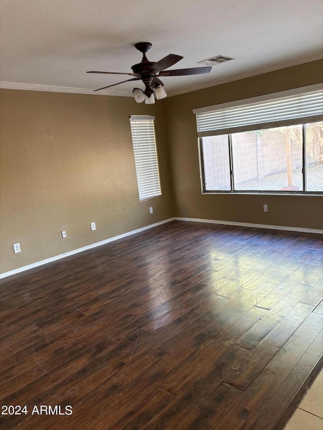 29101 N Yellow Bee Dr, San Tan Valley, AZ 85143 - spare room with dark wood finished floors, baseboards, ceiling fan, and visible vents