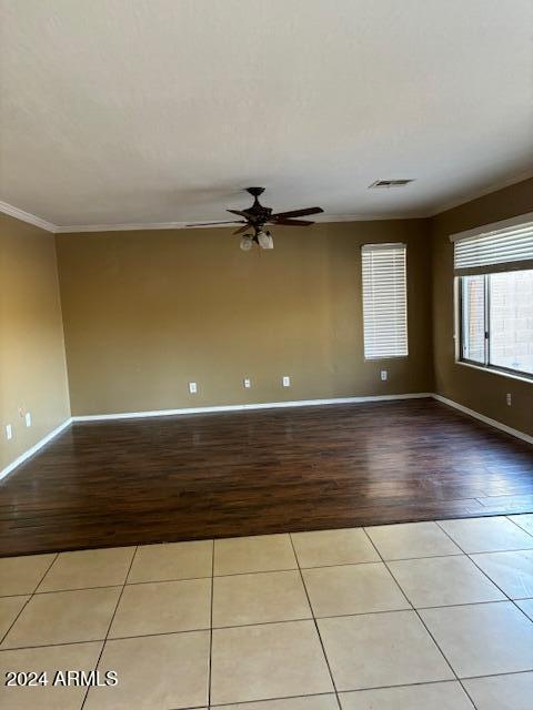 29101 N Yellow Bee Dr, San Tan Valley, AZ 85143 - unfurnished room featuring wood finished floors, crown molding, baseboards, and ceiling fan