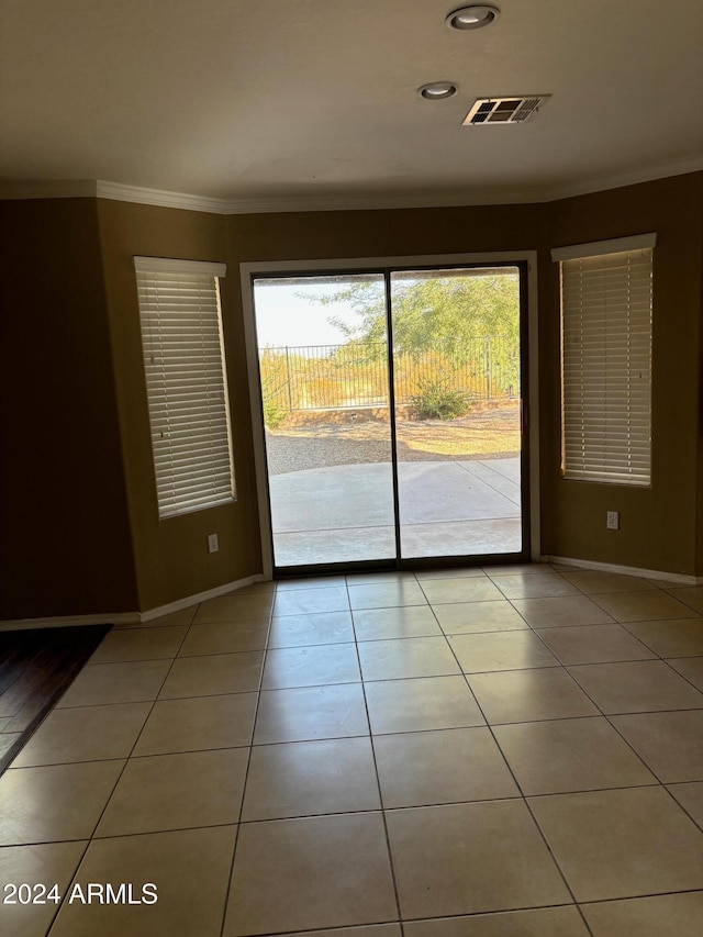 29101 N Yellow Bee Dr, San Tan Valley, AZ 85143 - unfurnished room with light tile patterned flooring, visible vents, crown molding, and baseboards