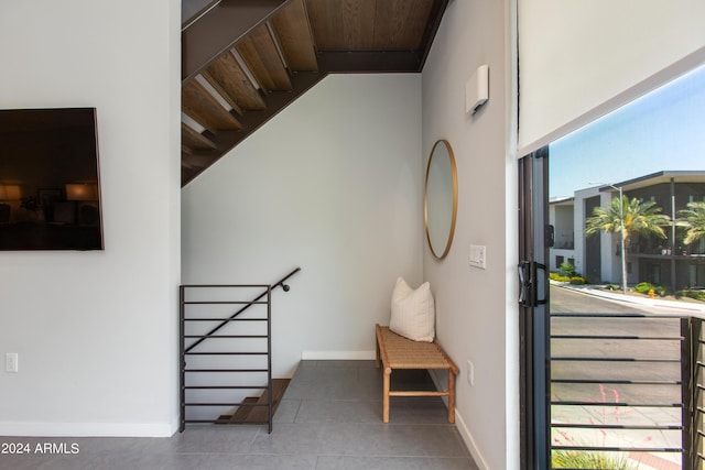 stairs with tile patterned floors