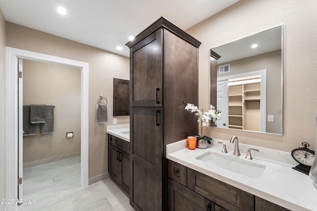 bathroom with vanity and tile patterned floors