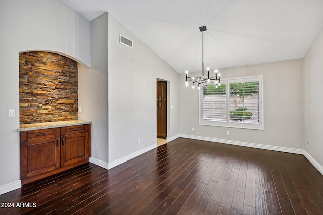 5544 E Paradise Ln, Scottsdale, AZ 85254 - unfurnished dining area with dark wood-type flooring, a chandelier, and lofted ceiling