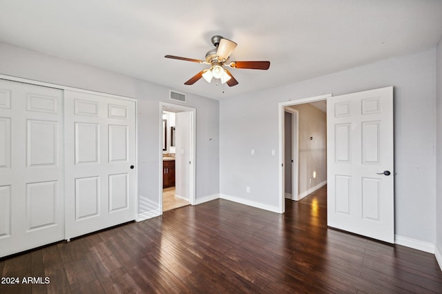 5544 E Paradise Ln, Scottsdale, AZ 85254 - unfurnished bedroom featuring dark wood-type flooring, a closet, and a ceiling fan