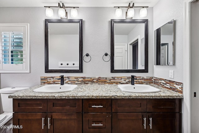 5544 E Paradise Ln, Scottsdale, AZ 85254 - bathroom with double vanity and tasteful backsplash
