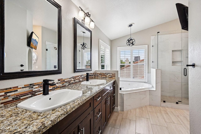 5544 E Paradise Ln, Scottsdale, AZ 85254 - bathroom with a garden tub, lofted ceiling, a stall shower, double vanity, and backsplash