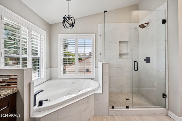 5544 E Paradise Ln, Scottsdale, AZ 85254 - full bath featuring a whirlpool tub, a stall shower, healthy amount of natural light, vanity, and vaulted ceiling