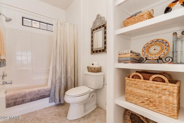 bathroom with tile patterned floors, shower / bath combination with curtain, and toilet