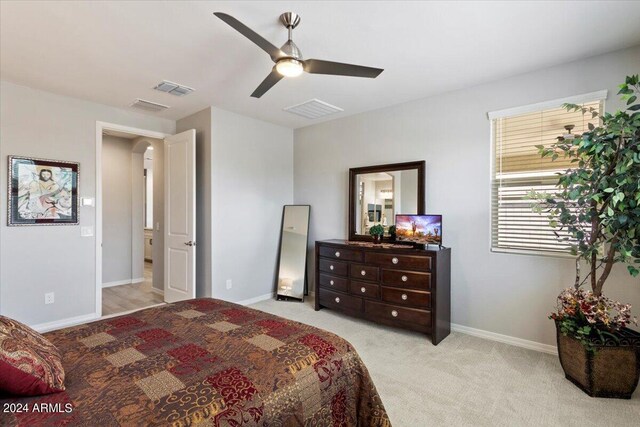 carpeted bedroom featuring ceiling fan