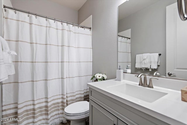 full bath with toilet and vanity