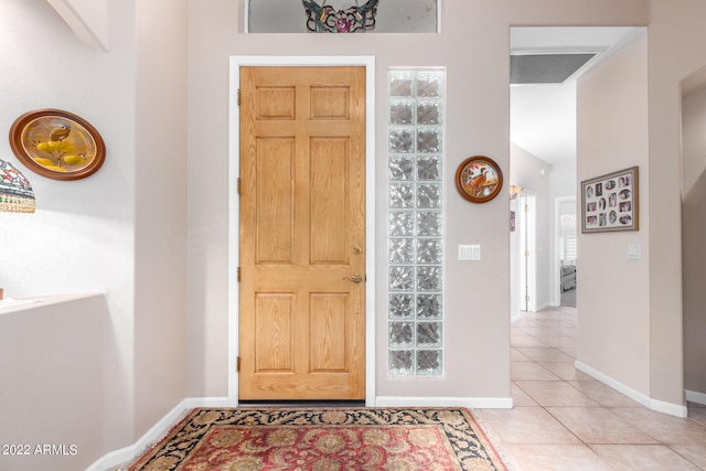 foyer featuring light tile patterned floors