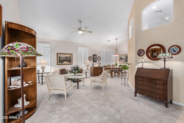 living room featuring light carpet and ceiling fan