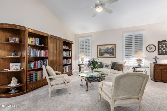 living room with vaulted ceiling, light colored carpet, and ceiling fan