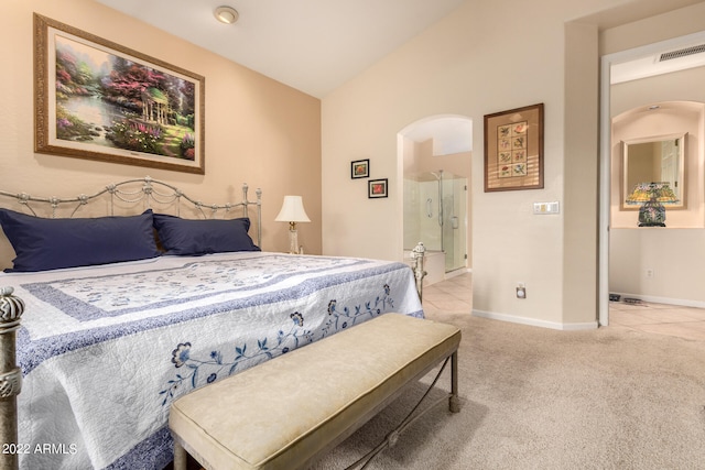 carpeted bedroom with vaulted ceiling