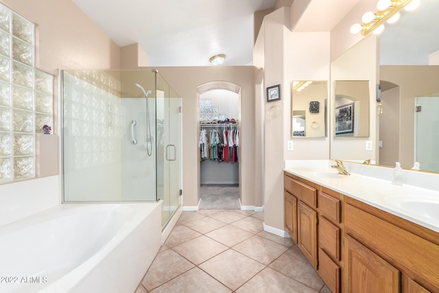 bathroom with vanity, tile patterned flooring, and separate shower and tub