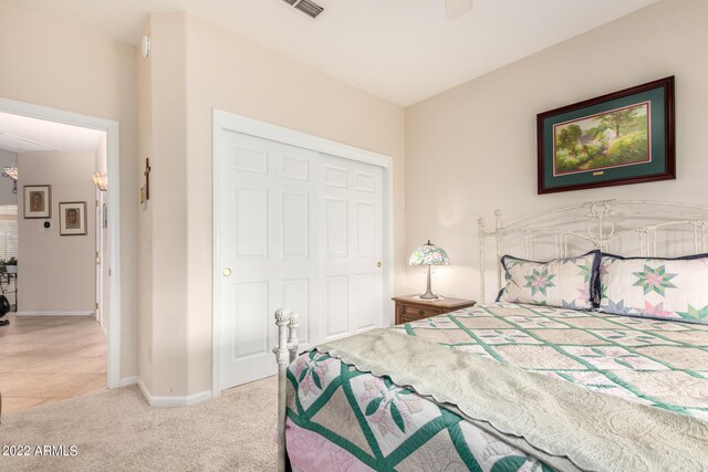 carpeted bedroom with a closet