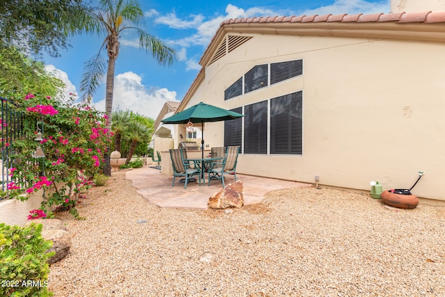 rear view of property with a patio area