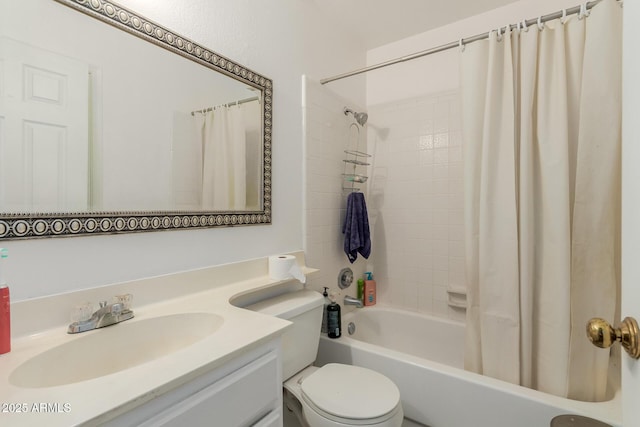 full bathroom featuring shower / tub combo with curtain, vanity, and toilet