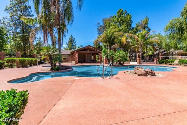 view of swimming pool with a patio