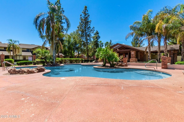 view of pool featuring a patio area