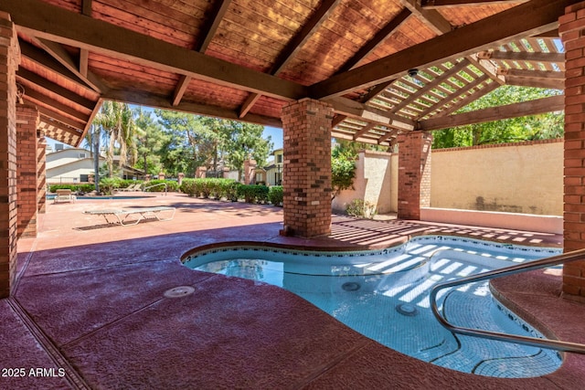 view of swimming pool featuring a patio area