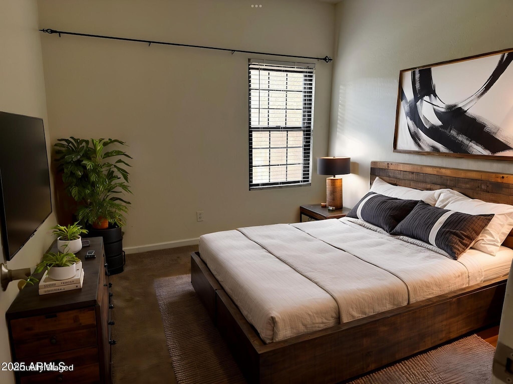 carpeted bedroom with baseboards