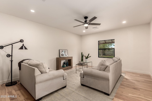 5612 N 9th St, Phoenix, AZ 85014 - living room with a ceiling fan, recessed lighting, light wood-style flooring, and baseboards