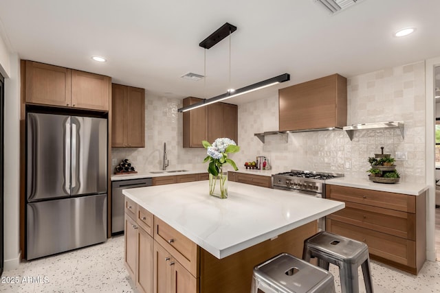 5612 N 9th St, Phoenix, AZ 85014 - kitchen featuring appliances with stainless steel finishes, a sink, decorative backsplash, light countertops, and recessed lighting