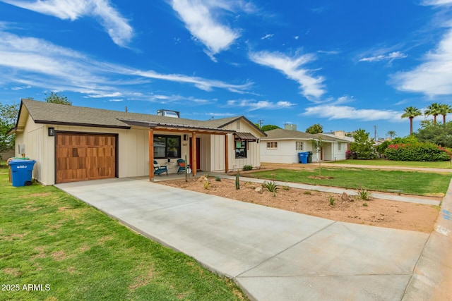 5612 N 9th St, Phoenix, AZ 85014 - ranch-style home with an attached garage, concrete driveway, and a front lawn