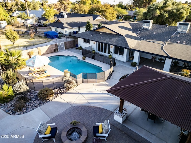 view of pool with a patio, an outdoor fire pit, and central air condition unit