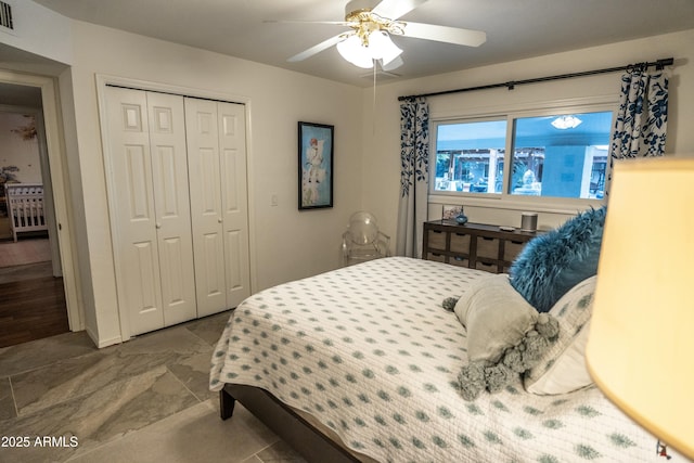 bedroom featuring ceiling fan and a closet