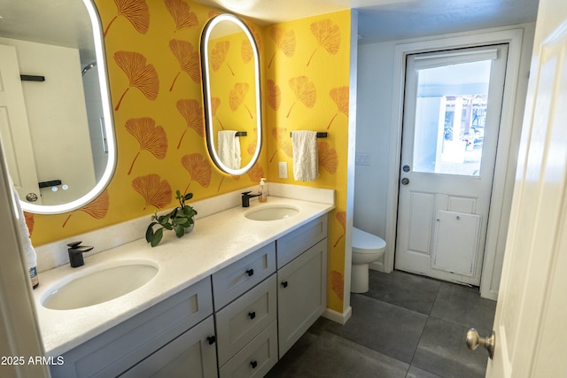 bathroom featuring tile patterned floors, vanity, and toilet