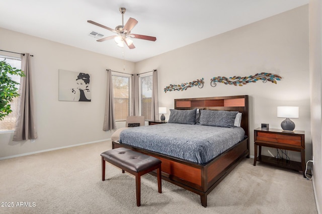 bedroom with visible vents, carpet, baseboards, and multiple windows