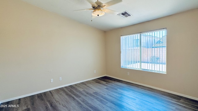 1630 W Pecan Rd, Phoenix, AZ 85041 - spare room featuring dark wood-style flooring and ceiling fan
