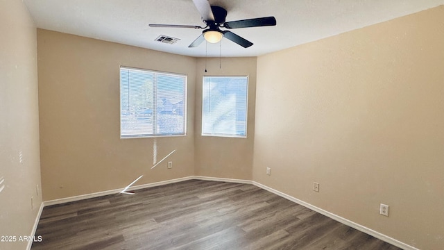 1630 W Pecan Rd, Phoenix, AZ 85041 - unfurnished room with a ceiling fan and dark wood-style floors