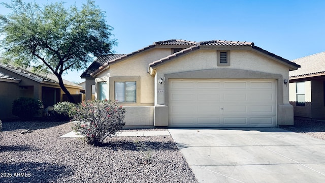 1630 W Pecan Rd, Phoenix, AZ 85041 - view of front of property with a tile roof, stucco siding, concrete driveway, and an attached garage