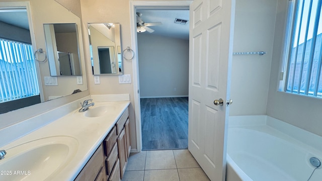 1630 W Pecan Rd, Phoenix, AZ 85041 - full bathroom with double vanity, a ceiling fan, a bath, and tile patterned floors
