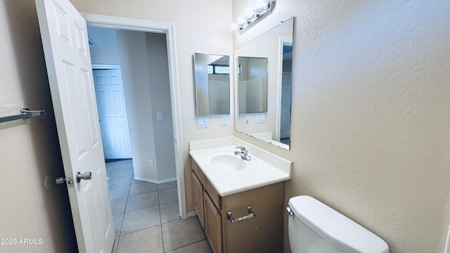 1630 W Pecan Rd, Phoenix, AZ 85041 - bathroom featuring vanity, a textured wall, and tile patterned flooring
