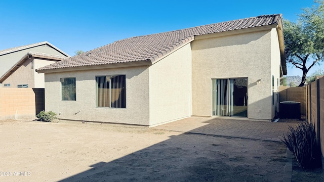 1630 W Pecan Rd, Phoenix, AZ 85041 - rear view of property with stucco siding, a fenced backyard, a tiled roof, and a patio