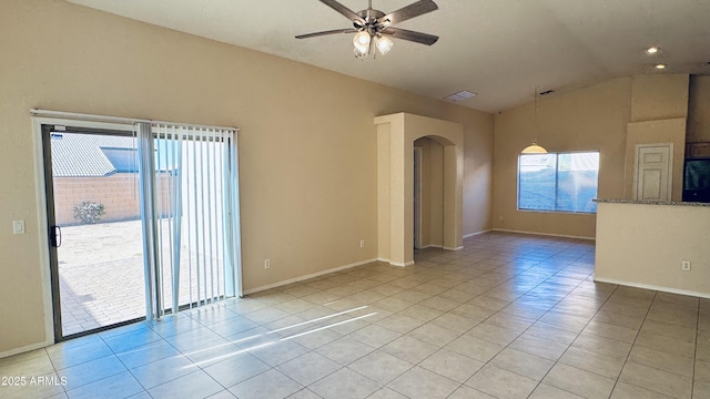 1630 W Pecan Rd, Phoenix, AZ 85041 - spare room featuring arched walkways, light tile patterned floors, a ceiling fan, and lofted ceiling