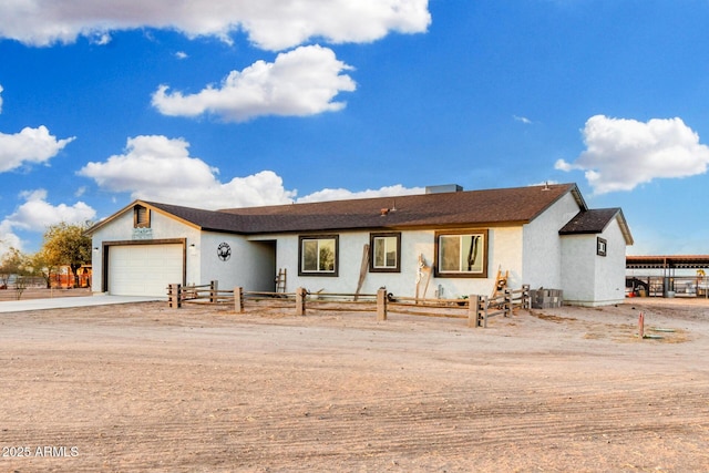 ranch-style house featuring a garage