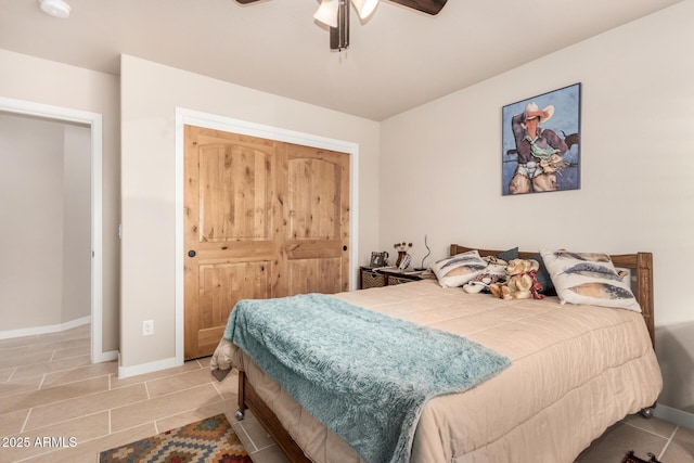 bedroom with ceiling fan and a closet