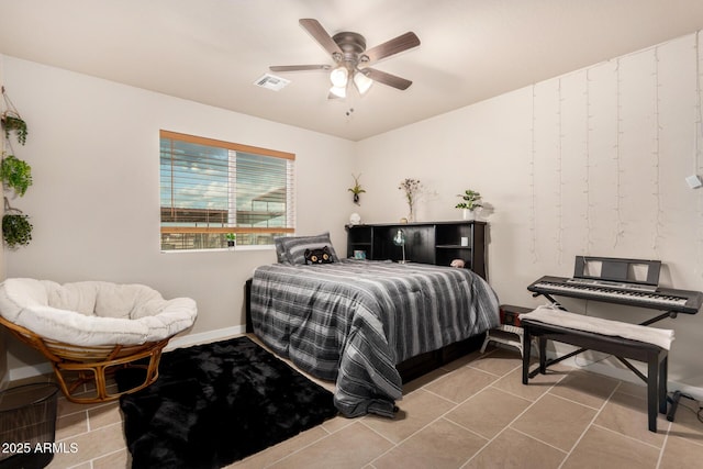 bedroom featuring light tile patterned floors and ceiling fan