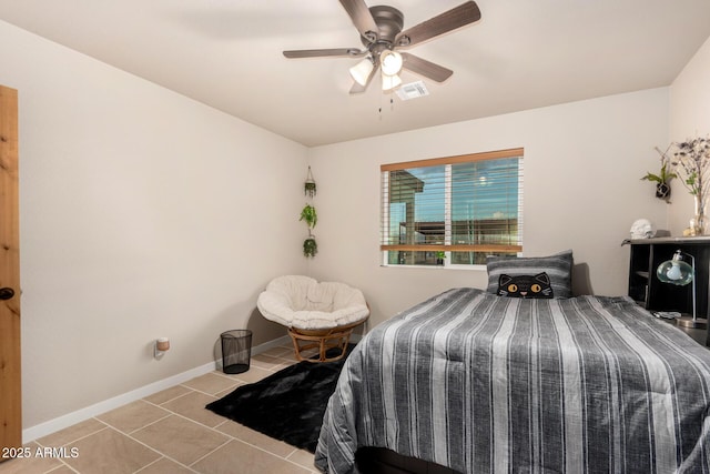 tiled bedroom with ceiling fan