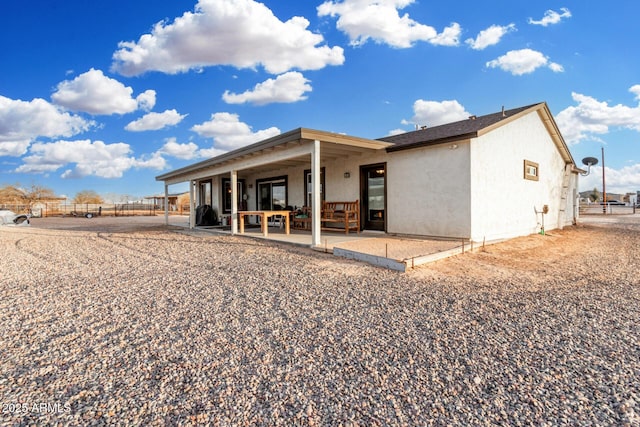 rear view of house with a patio