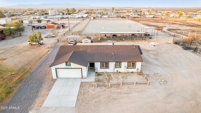 birds eye view of property with a mountain view