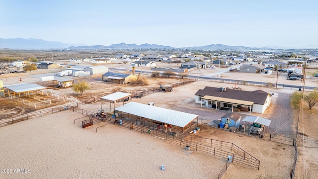 birds eye view of property featuring a mountain view