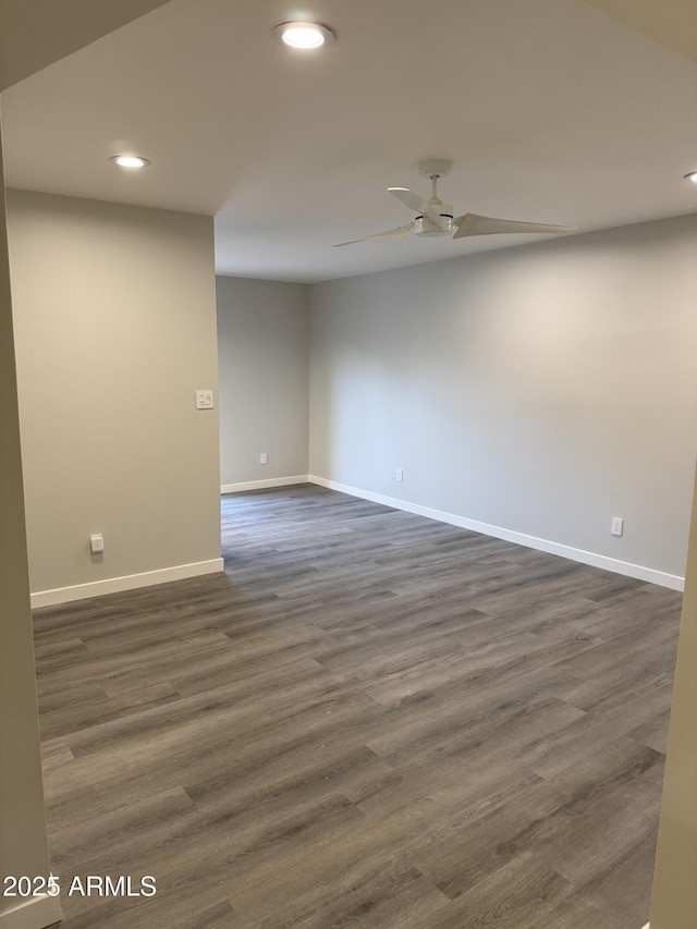 empty room with recessed lighting, baseboards, dark wood-style floors, and a ceiling fan