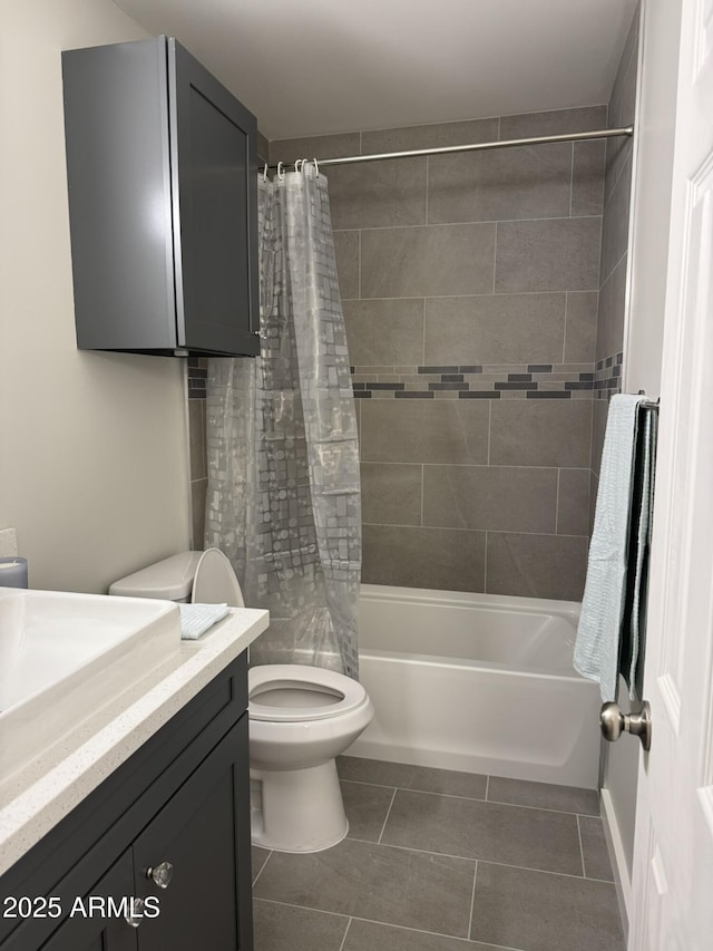 full bath with vanity, toilet, shower / tub combo, and tile patterned flooring