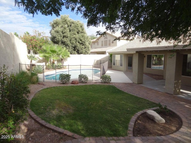 view of yard featuring a patio area, a fenced backyard, and a fenced in pool