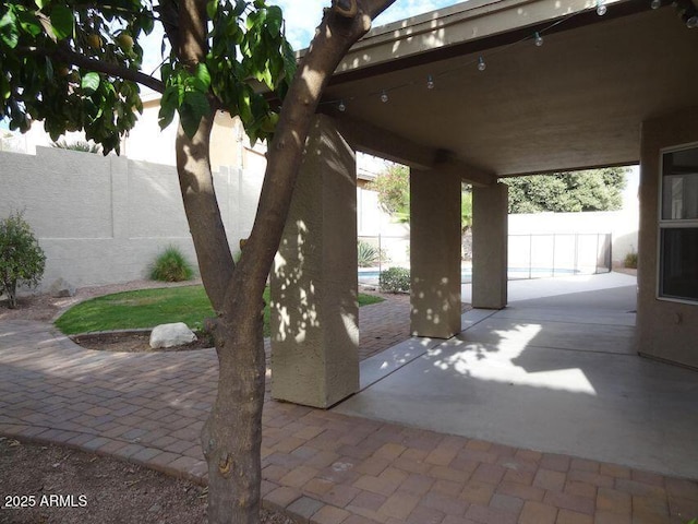 view of patio / terrace with a fenced in pool and a fenced backyard